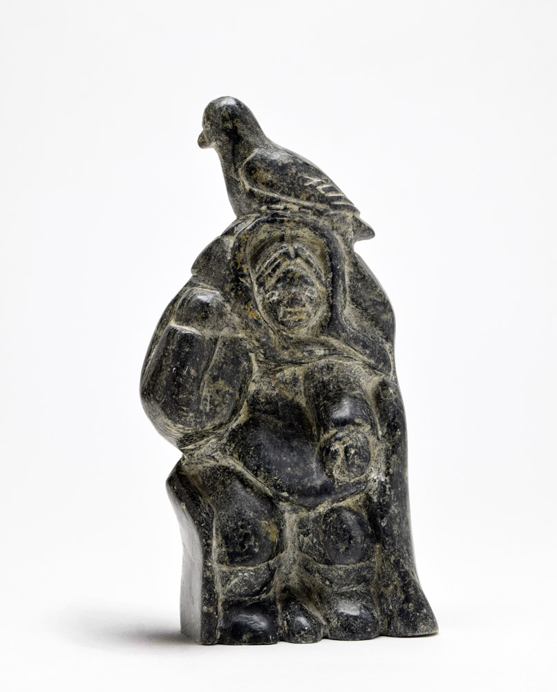 18. Unattributed, Puvirnituq, woman with bird, circa 1960, stone, 8 x 4 ...